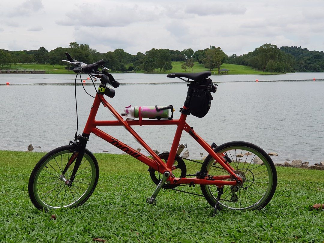 Tyrell FX (Category: Bicycles) located in Singapore. Submitted by v8craz (Listing ID 1463684191, Image 1). Description: A bright orange Tyrell FX folding bike impresses with - 20-inch wheels - a stylish aluminum X-frame - weighs about 7-8kg with its 10-speed Shimano Tiagra gears - special grips.
