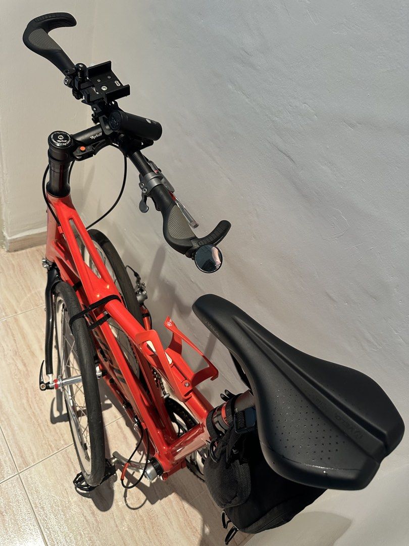 Tyrell FX (Category: Bicycles) located in Singapore. Submitted by v8craz (Listing ID 1463684191, Image 4). Description: A bright orange Tyrell FX folding bike impresses with - 20-inch wheels - a stylish aluminum X-frame - weighs about 7-8kg with its 10-speed Shimano Tiagra gears - special grips.