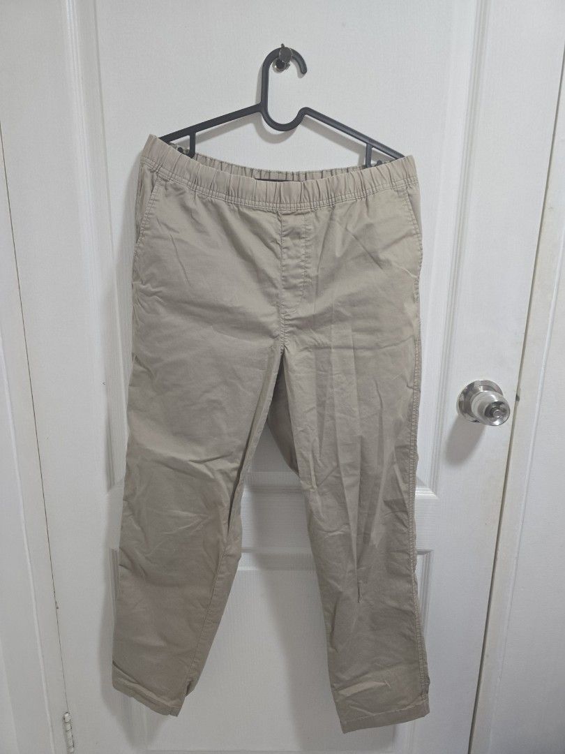 Uniqlo Khaki Cargo Pants with Drawstring Waist (Category: Jeans) located in Pasig City. Submitted by callmemaf (Listing ID 1463574563, Image 1). Description: - Khaki cargo pants - Elastic waistband with drawstring closure - Multiple pockets for ample storage - Comfortable fit for all-day wear - Versatile for casual outings or outdoor adventures - Effortlessly styled with various tops - Ideal for everyday use.