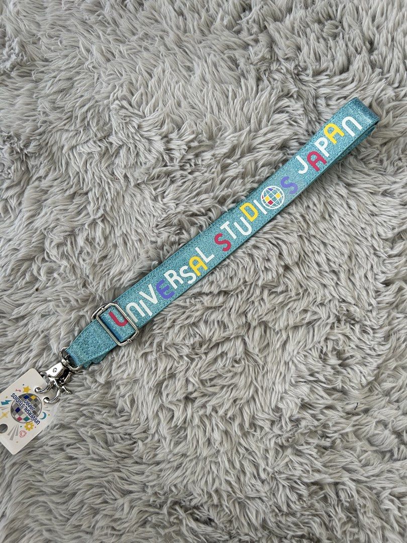 Universal Studios Japan Glitter Lanyard Shoulder Belt (Category: Luxury Accessories) located in Dasmarinas. Submitted by sfclosetcleanup (Listing ID 1463621260, Image 1). Description: - Authentic Glitter Lanyard from Universal Studios Japan - Features iconic park logo and 'Universal Studios Japan' text - Includes a convenient shoulder belt attachment - Comes with original tags attached - Ideal for securely carrying park passes, ID, or keys - A fu