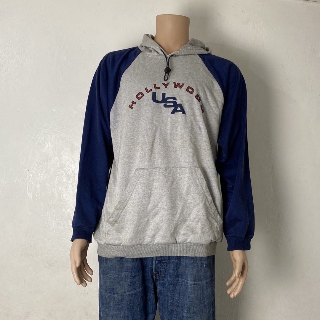 UNTAG 🏃‍♀️| Two-Tone Pull-Over Hoodie (Category: Hoodies) located in Bulacan. Submitted by orc.ph (Listing ID 1463660744, Image 2). Description: UNTAG 🏃‍♀️| Two-Tone Pull-Over Hoodie Material Used: Polyester -Blue / Gray -Loose Fit -“HOLLYWOOD USA” Spell-Out -Parachute Hood Drawchord -Kangaroo Pouch -Casual -Active Wear -Streetwear ‎-Size: XL -Width: 24” ‎-Length: 27” Used Condition. Minir Visible Flaws. Issue: Un/Washable Stains ‎ ‎⚠️Note: For