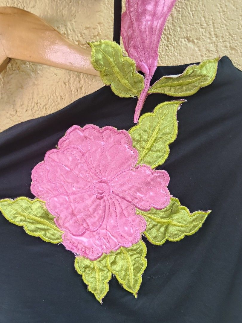 Utopia Black Off-Shoulder Top with Pink Flower Applique (Category: Sleeveless) located in City of Isabela. Submitted by jasheverything (Listing ID 1463567362, Image 3). Description: - Black off-shoulder top - Features a large pink flower applique with green leaves on the front - Thin straps - Fun and unique design - Versatile for casual wear or a night out Excellent Condition 550+SF.