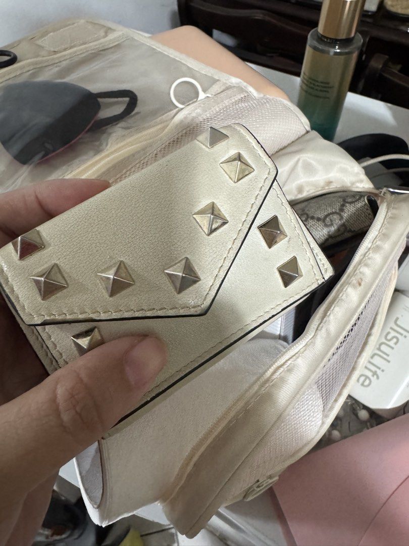 Valentino Garavani Rockstud Wallet (Category: Luxury Bags & Wallets) located in Marilao. Submitted by cj458678 (Listing ID 1463605487, Image 1). Description: - Authentic Valentino Garavani wallet - Cream leather with signature Rockstud details - Made in Italy - Small and compact design, perfect for cards and cash - Gold hardware.