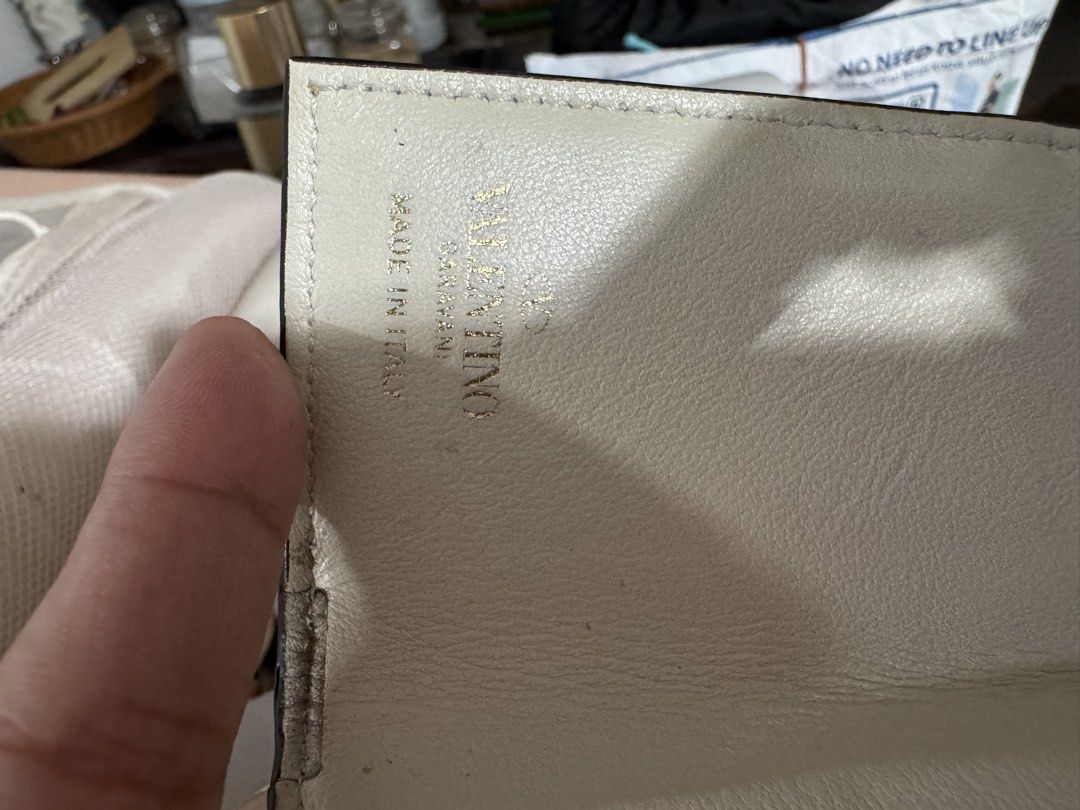 Valentino Garavani Rockstud Wallet (Category: Luxury Bags & Wallets) located in Marilao. Submitted by cj458678 (Listing ID 1463605487, Image 2). Description: - Authentic Valentino Garavani wallet - Cream leather with signature Rockstud details - Made in Italy - Small and compact design, perfect for cards and cash - Gold hardware.