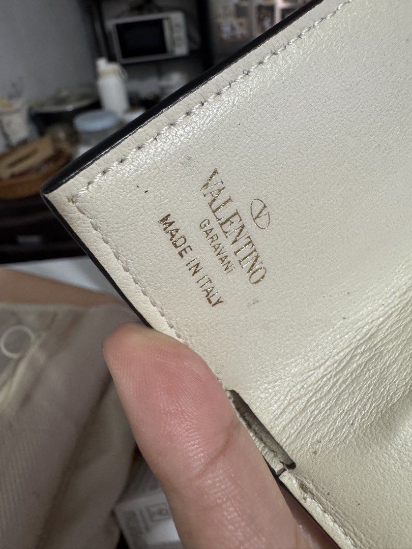 Valentino Garavani Rockstud Wallet (Category: Luxury Bags & Wallets) located in Marilao. Submitted by cj458678 (Listing ID 1463605487, Image 3). Description: - Authentic Valentino Garavani wallet - Cream leather with signature Rockstud details - Made in Italy - Small and compact design, perfect for cards and cash - Gold hardware.