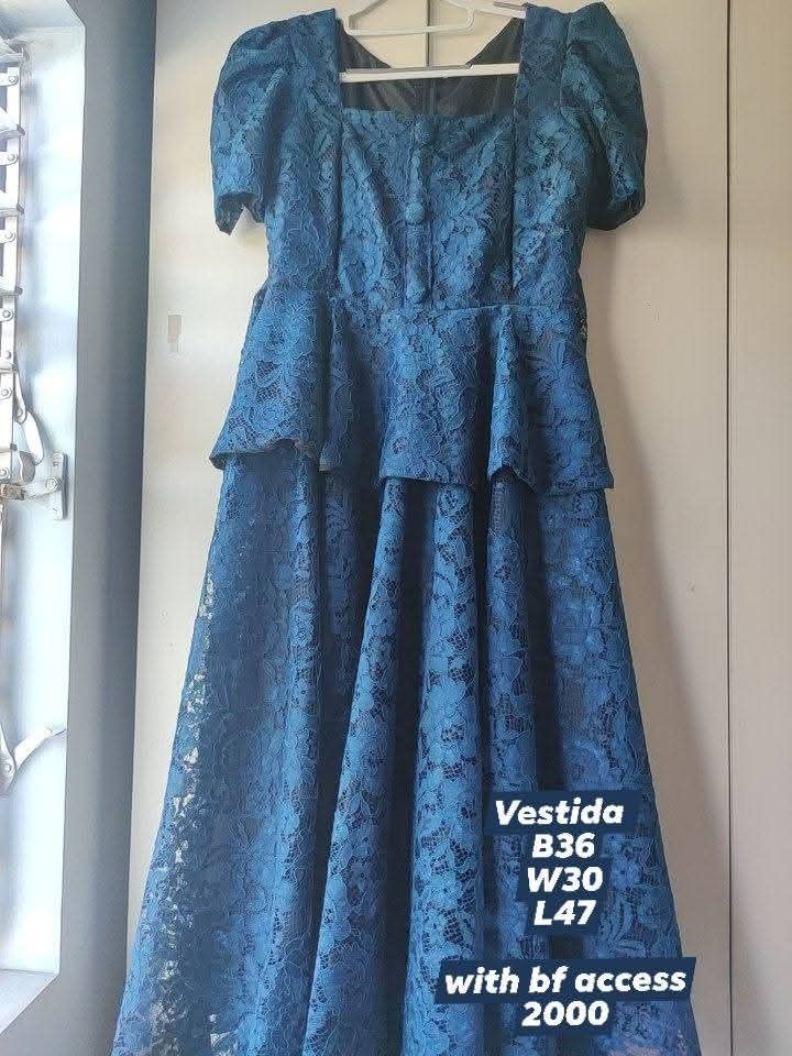 Vestida Celestelle (Category: Dresses) located in Bacolod City. Submitted by leighleigh17 (Listing ID 1463653444, Image 1). Description: - Beautiful blue lace dress - Elegant square neckline - Chic puff sleeves - Flattering peplum waist - Flowy tiered skirt - Ideal for parties and special events - Convenient back zipper closure - Measurements: Bust 36", Waist 30", Length 47" with breastfeeding zipper sa side.