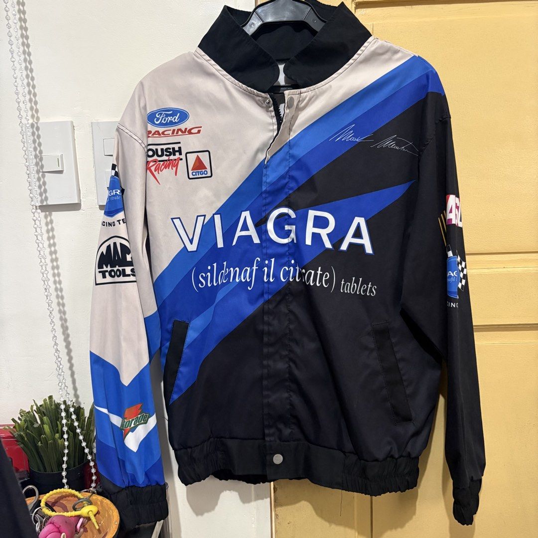 Viagra Racing Jacket (Category: Coats, Jackets and Outerwear) located in Makati City. Submitted by sseurekiii (Listing ID 1463721127, Image 1). Description: - Cool racing jacket featuring Viagra and Roush Racing branding. - Includes Ford and other sponsor logos. - Stylish black, blue, and beige colorway. - Convenient zipper closure. - Comfortable ribbed cuffs and hem. - Ideal for racing enthusiasts and unique streetwear fashion..