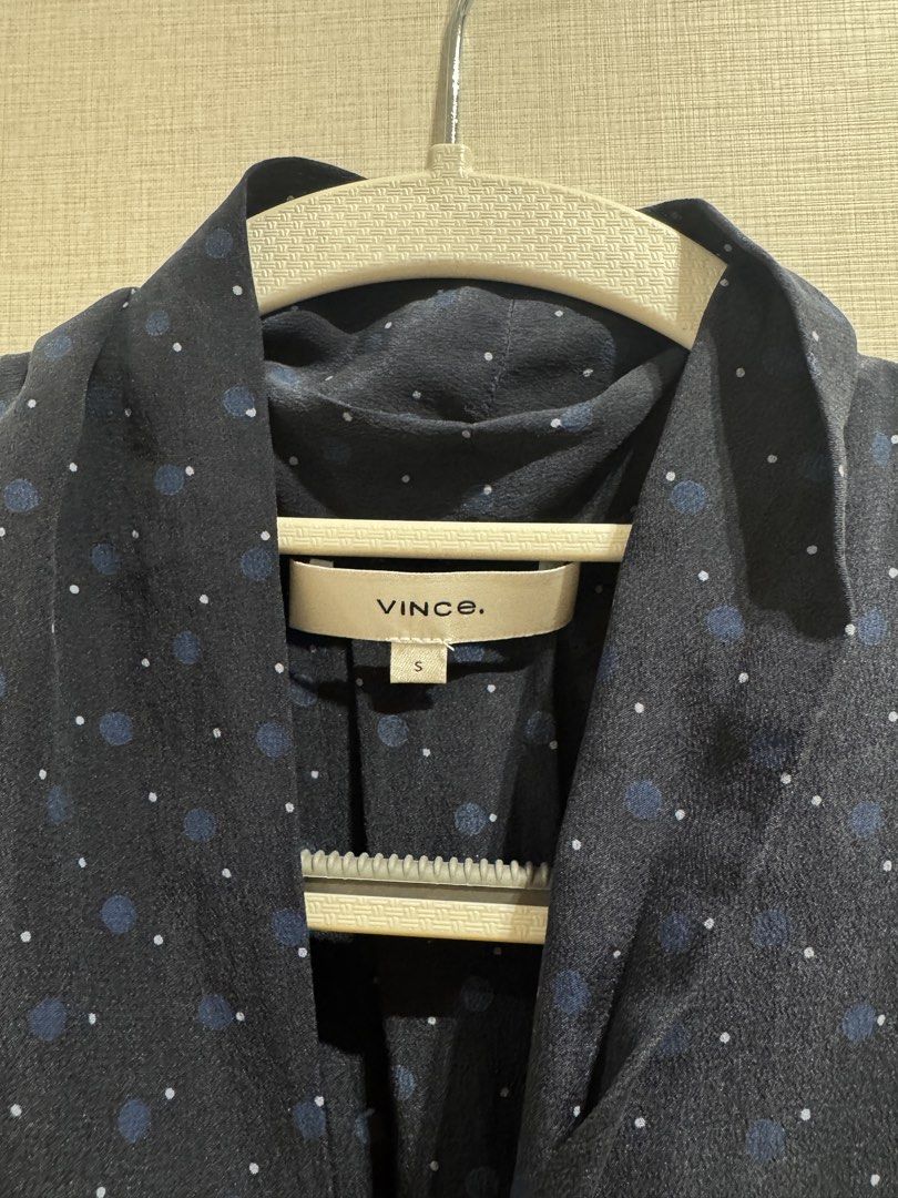 Vince Navy Blue Sleeveless Blouse (Category: Sleeveless) located in Quezon City. Submitted by envti (Listing ID 1463703510, Image 3). Description: - Vince sleeveless blouse - Navy blue with subtle all-over polka dot pattern - Unique draped neckline detail - Versatile: great for layering or wearing on its own - Chic and sophisticated style.