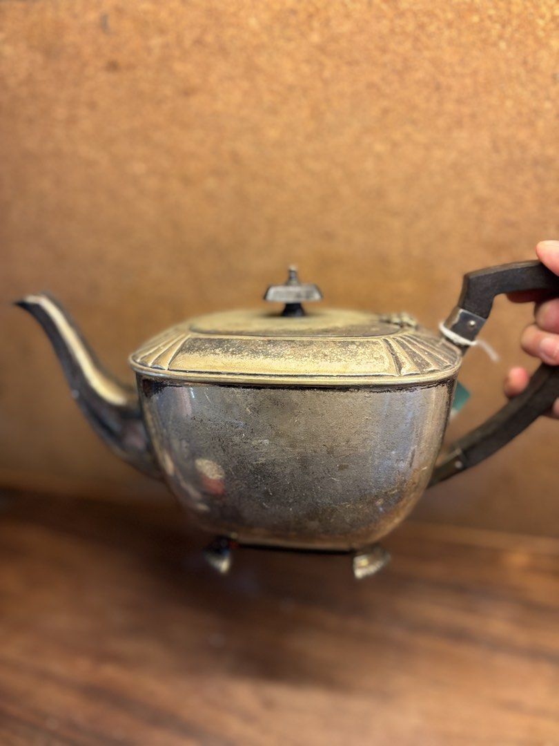 Vintage Art Deco Teapot (Category: Coffee & Tea Tableware) located in Marikina City. Submitted by therealmalouhibaler (Listing ID 1463635391, Image 1). Description: - Vintage Art Deco silver-plated teapot - Elegant footed base - Shows some tarnishing and wear, consistent with age - Ideal for decorative display or functional use .