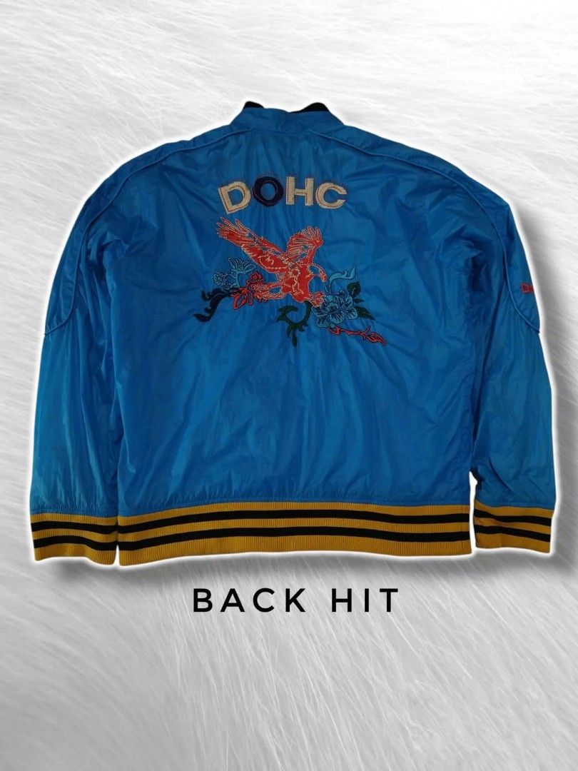 Vintage bomber jacket (Category: Coats, Jackets and Outerwear) located in Samal. Submitted by mltd_06 (Listing ID 1463741989, Image 2). Description: DOHC BOMBER JACKET - 90s VINTAGE 🔵🦅 DOHC = Double Overhead Camshaft - pang racing engine ng mga sports car. Nung 90s ginawang brand ng mga souvenir jackets sa Korea/Japan - parang VTEC - symbol ng bilis. • Size: 22x26 / L • Color: Royal Blue - Gold/Black ribbings • Details: Red Eagle + Flowers sa l