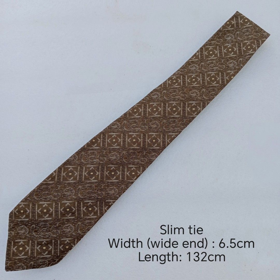 Vintage Bronze Geometric Box Patterned necktie (Category: Ties) located in Abucay. Submitted by gibzzz123 (Listing ID 1463574135, Image 2). Description: • All items are ON HAND and ready to be shipped/picked up. • Items are preloved/ukay, so please expect minimal signs of usage unless stated otherwise. • No major issues — good condition unless otherwise indicated in the listing. • Actual color may slightly vary due to lighting and screen settings