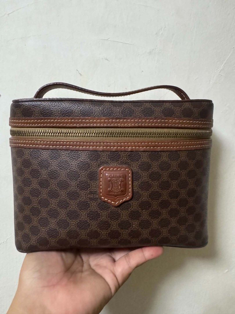 vintage Celine Monogram Vanity Case Cosmetic Bag (Category: Luxury Bags & Wallets) located in Meycauayan. Submitted by cosmicdolphin-5cabff (Listing ID 1463565753, Image 1). Description: - Vintage Celine monogram vanity case - Classic brown and gold pattern - Genuine leather trim and handle - Secure zipper closure - Interior stamped 'CELINE PARIS MADE IN ITALY' and 'MC96' - Ideal for makeup, toiletries, or travel essentials.