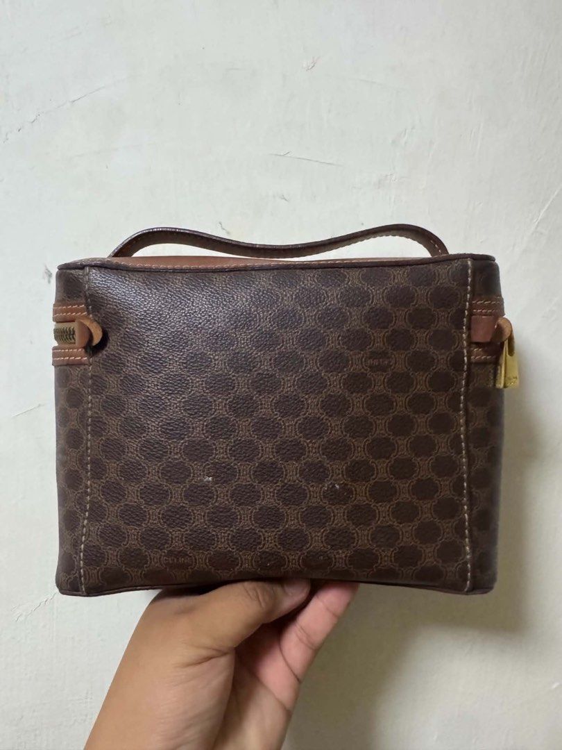 vintage Celine Monogram Vanity Case Cosmetic Bag (Category: Luxury Bags & Wallets) located in Meycauayan. Submitted by cosmicdolphin-5cabff (Listing ID 1463565753, Image 2). Description: - Vintage Celine monogram vanity case - Classic brown and gold pattern - Genuine leather trim and handle - Secure zipper closure - Interior stamped 'CELINE PARIS MADE IN ITALY' and 'MC96' - Ideal for makeup, toiletries, or travel essentials.