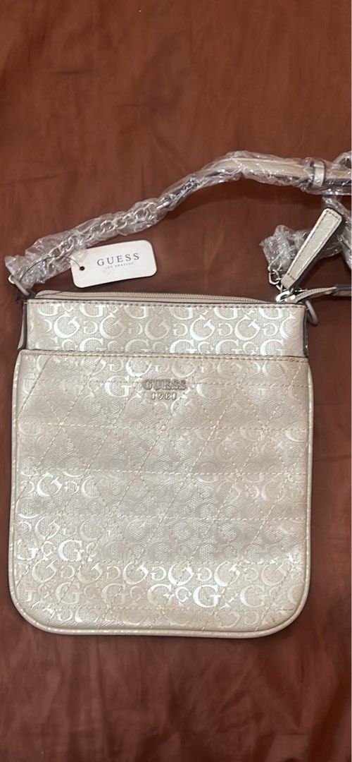 Vintage Guess Bag (Category: Cross-body Bags) located in Manila. Submitted by petitediva (Listing ID 1463574816, Image 1). Description: vintage GUESS cross body bag silver color all good condition no defect.