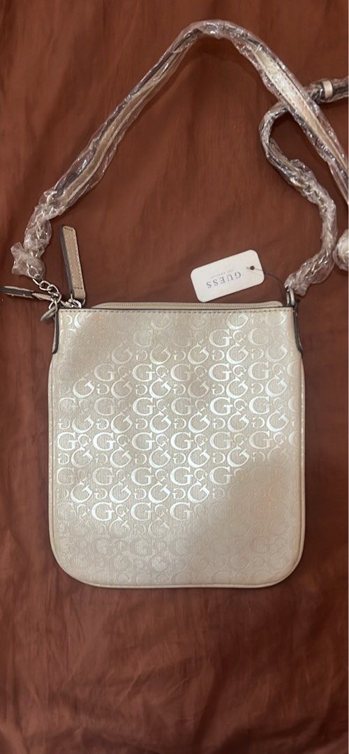 Vintage Guess Bag (Category: Cross-body Bags) located in Manila. Submitted by petitediva (Listing ID 1463574816, Image 2). Description: vintage GUESS cross body bag silver color all good condition no defect.