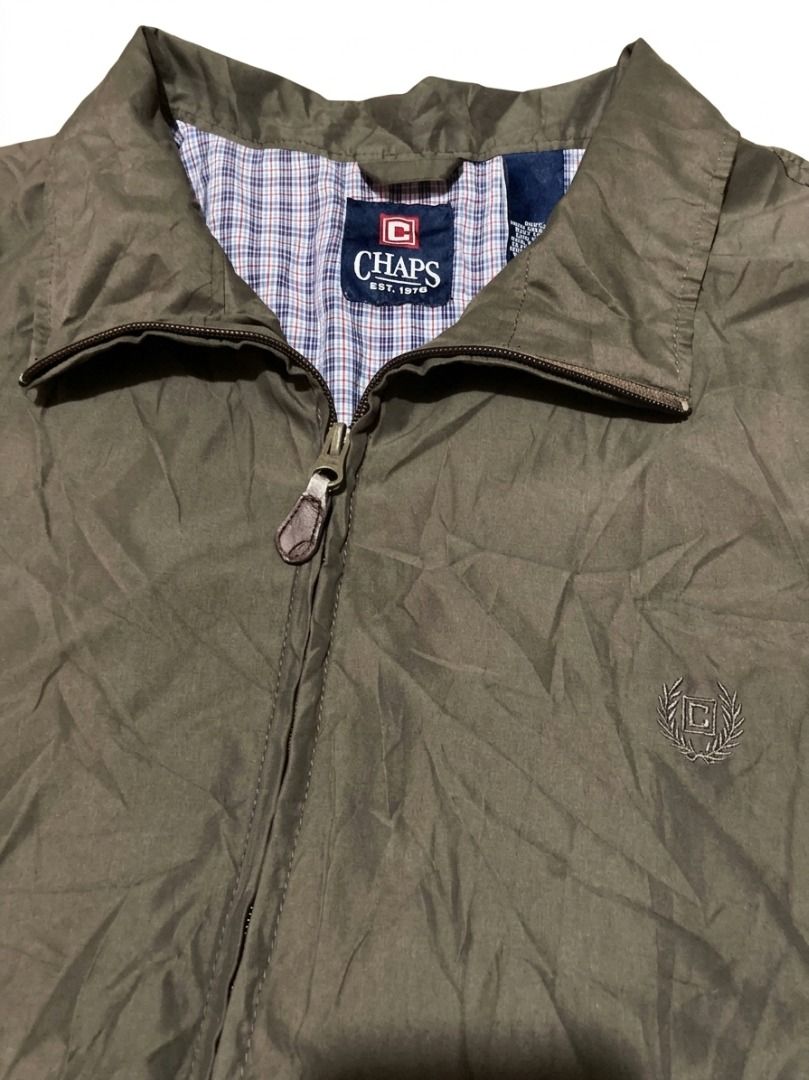 VINTAGE HARRINGTON Chaps Olive Green Zip-Up Jacket (Category: Coats, Jackets and Outerwear) located in Pasay City. Submitted by ken_98 (Listing ID 1463589852, Image 3). Description: - Olive green Chaps jacket - Zip-up front with collared neckline - Classic plaid pattern lining - Two front pockets with button closures - Button cuffs on sleeves - Ideal for layering w27.5 x L27.