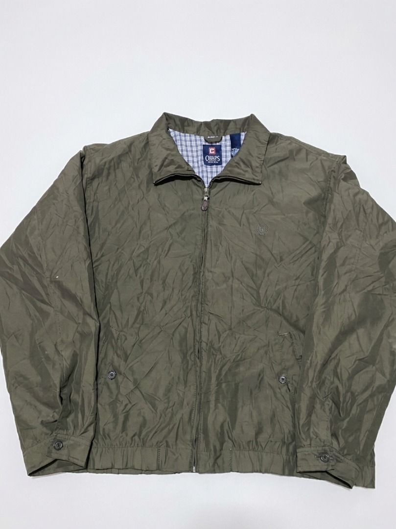 VINTAGE HARRINGTON Chaps Olive Green Zip-Up Jacket (Category: Coats, Jackets and Outerwear) located in Pasay City. Submitted by ken_98 (Listing ID 1463589852, Image 1). Description: - Olive green Chaps jacket - Zip-up front with collared neckline - Classic plaid pattern lining - Two front pockets with button closures - Button cuffs on sleeves - Ideal for layering w27.5 x L27.