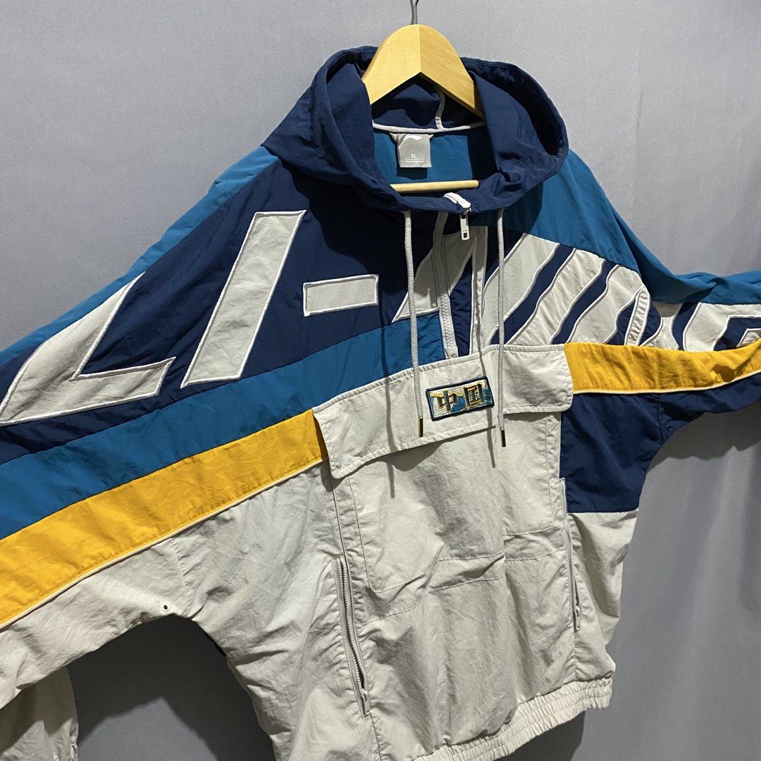 Vintage Li-ning jacket (Category: Coats, Jackets and Outerwear) located in Baguio. Submitted by loc_bc (Listing ID 1463716948, Image 2). Description: vintage Li-Ning tricolor half-zip windbreaker featuring a prominent front kangaroo pocket with a Chinese character patch.
