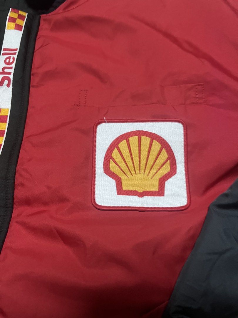 Vintage Shell Racing Jacket Red Black (Category: Coats, Jackets and Outerwear) located in Bacoor. Submitted by rtrpyu.2023 (Listing ID 1463595914, Image 3). Description: - Vintage Shell jacket - Red body with black sleeves and collar - Iconic Shell logo on the chest - Racing stripes down the front - Elasticated cuffs and hem - Ideal for Shell enthusiasts and collectors - A stylish addition to any wardrobe 26x26 Boxy large.