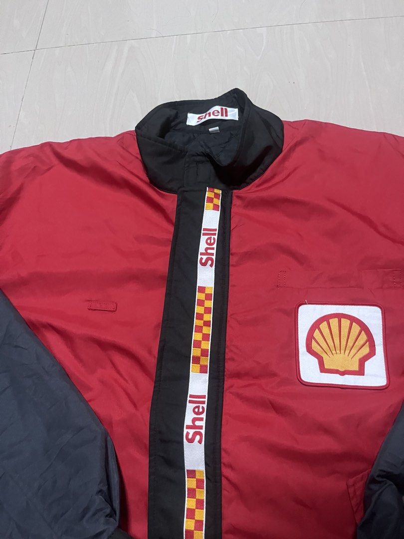 Vintage Shell Racing Jacket Red Black (Category: Coats, Jackets and Outerwear) located in Bacoor. Submitted by rtrpyu.2023 (Listing ID 1463595914, Image 2). Description: - Vintage Shell jacket - Red body with black sleeves and collar - Iconic Shell logo on the chest - Racing stripes down the front - Elasticated cuffs and hem - Ideal for Shell enthusiasts and collectors - A stylish addition to any wardrobe 26x26 Boxy large.