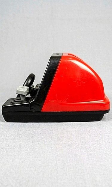Vintage table-top electronic driving toy (Category: Kids Toys) located in San Pedro. Submitted by emplaything (Listing ID 1463721411, Image 3). Description: - Retro handheld driving game - Features a realistic steering wheel and gear shifter - Screen displays a road with cars for an immersive experience - Durable black and red plastic casing - Battery operated (batteries not included) - Vintage toy - In Very good condition Working Well - Perfect 