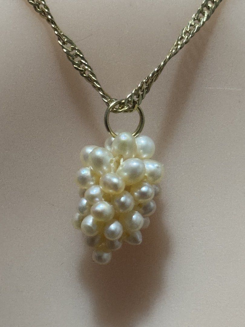 vintage-style grape cluster pendant necklace (Category: Necklaces) located in Angeles City. Submitted by zyeplustradings (Listing ID 1463605185, Image 2). Description: vintage-style grape cluster pendant necklace textured gold-toned twist chain supporting a dangling cluster of small, lustrous white seed pearls arranged to resemble a bunch of grapes..