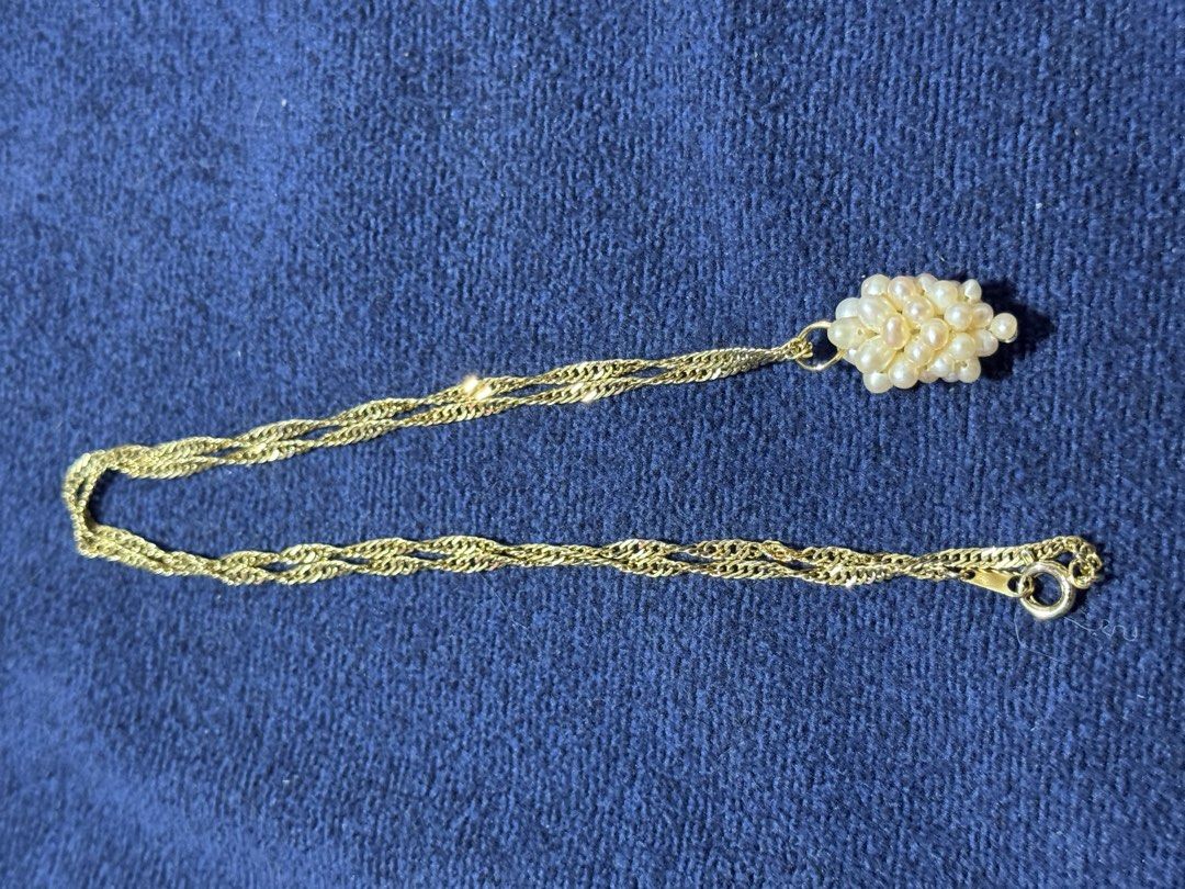 vintage-style grape cluster pendant necklace (Category: Necklaces) located in Angeles City. Submitted by zyeplustradings (Listing ID 1463605185, Image 3). Description: vintage-style grape cluster pendant necklace textured gold-toned twist chain supporting a dangling cluster of small, lustrous white seed pearls arranged to resemble a bunch of grapes..