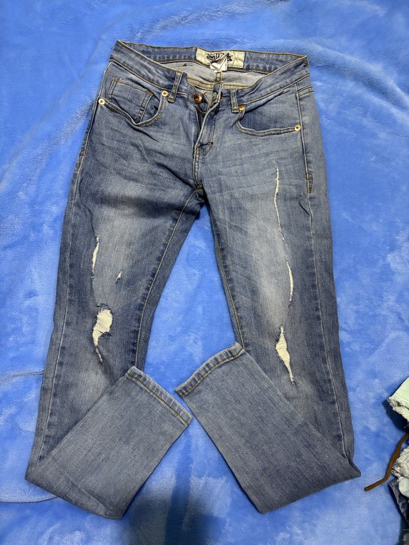 Von Dutch Distressed Denim Jeans Size 27 (Category: Jeans) located in Valenzuela. Submitted by roxie018 (Listing ID 1463721339, Image 1). Description: - Light wash Von Dutch jeans - Size 27 - Distressed detailing on the front - Classic five-pocket styling - Embroidered back pockets - Button and zip fly closure - Ideal for a casual look.