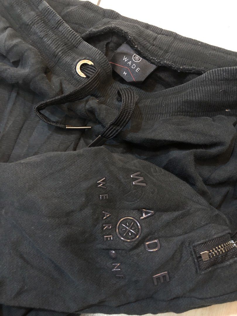 Wade Black Jogger Pants Size M (Category: Joggers) located in Manila. Submitted by bakithrift213 (Listing ID 1463635052, Image 2). Description: - Brand: Wade - Color: Black - Size: Medium (M) - Features: Elastic waistband with drawstring, zipper pockets on both sides, ribbed cuffs - Comfort: Ideal for everyday wear.