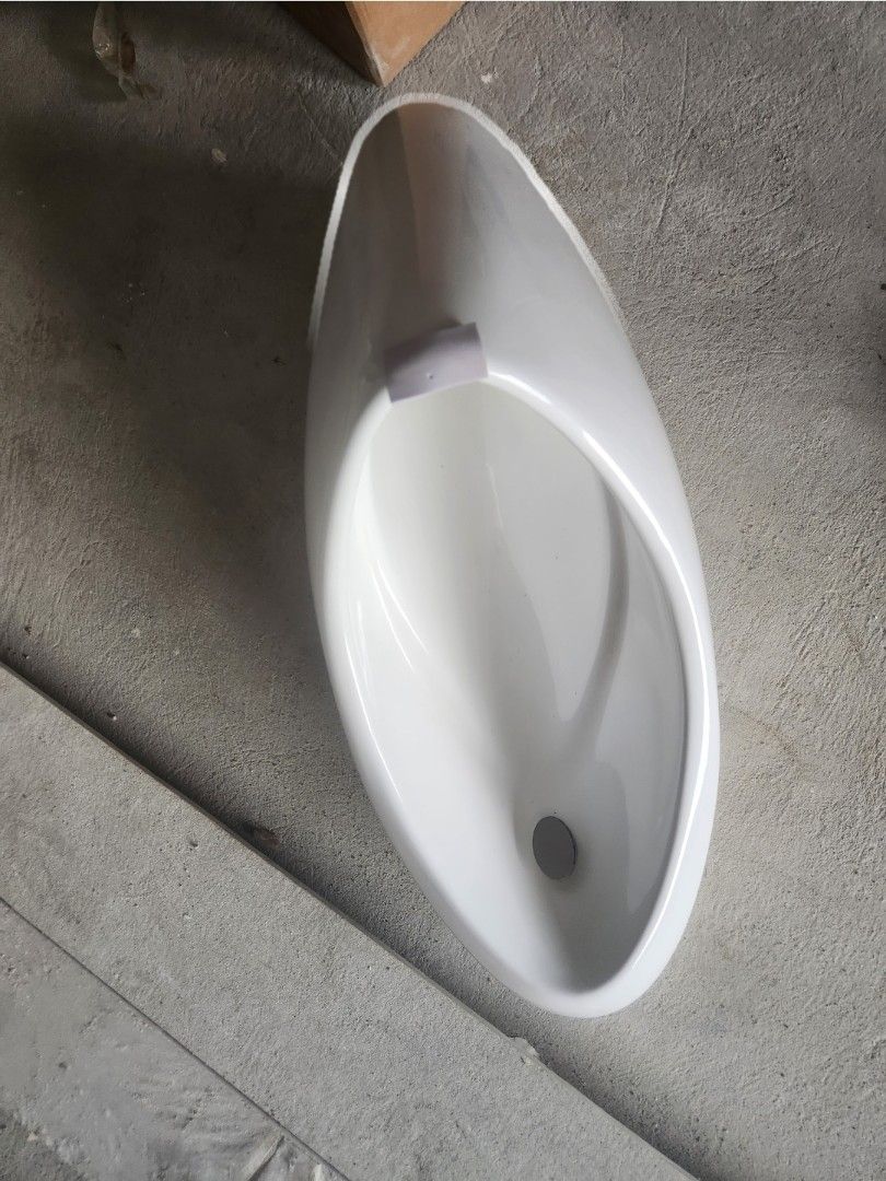 Wall-hung Urinal Model 121 - 270x360x685mm (Category: Bathroom & Kitchen Fixtures) located in Taguig. Submitted by lunakelsey (Listing ID 1463568922, Image 2). Description: - Wall-hung urinal, Model 121 - Compact dimensions: 270mm (W) x 360mm (D) x 685mm (H) - Flexible water inlet: Can connect from the back or top - Compatible with both S-trap and P-trap drainage systems - All necessary fittings and installation instructions included - Ideal for 