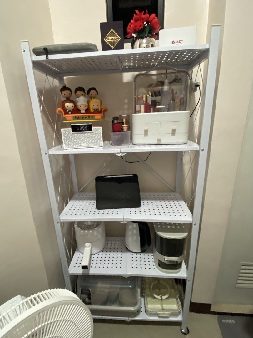 White 5-Tier Foldable Shelf with Wheels (Category: Shelves, Cabinets & Racks) located in Quezon City. Submitted by chinserrano (Listing ID 1463678811, Image 2). Description: * Foldable and space-saving * With wheels for easy movement * Sturdy metal frame * Easy to store when not in use * Still in good condition Original Price: P1,100 Selling Price: P700 RFS: Will no longer fit in our new apartment .