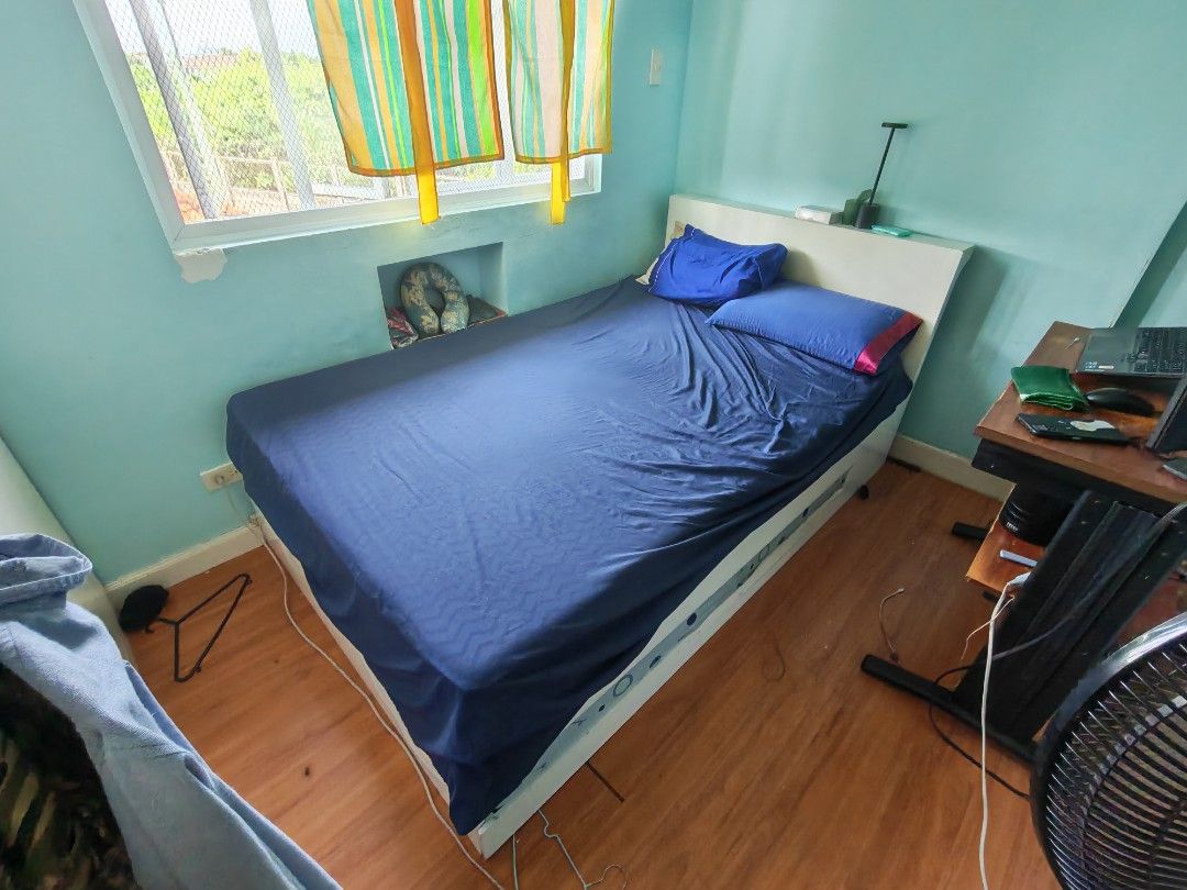 Bed Frame with Foam Mattress (Double/Full) (Category: Bed Frames & Mattresses) located in Binan City. Submitted by sebzsebastian (Listing ID 1463660491, Image 1). Description: Double bed with single pull-out bed and built-in storage on one side. ​Includes: ​Double bed frame (heavy mahogany wood) ​Double foam mattress ​Pull-out single trundle bed (no mattress included) ​Dimensions: ​Length: 210 cm ​Width: 145 cm ​Height: 40 cm ​Notes: ​Frame needs