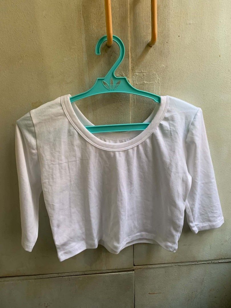 White Cropped Top with 3/4 Sleeves (Category: Blouses) located in Manila. Submitted by usagichan_rabbit (Listing ID 1463572654, Image 1). Description: - Basic white super cropped top size xs - Features 3/4 sleeves - Simple and versatile design - Perfect for dressing up or down - Great for layering or wearing solo - Effortlessly matches any wardrobe piece.