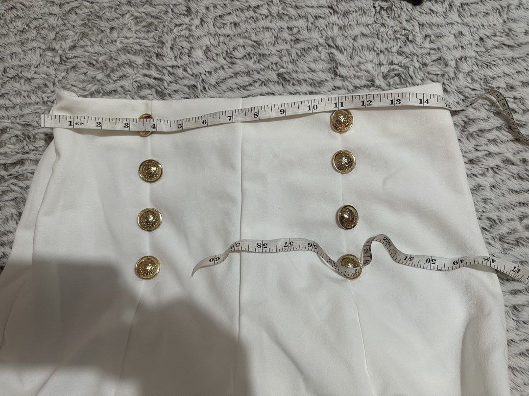 White High-Waisted Pants with Gold Button Detail (Category: Other Bottoms) located in Subic. Submitted by ruffa_assorted_item (Listing ID 1463632985, Image 3). Description: - Stylish white high-waisted pants - Elegant gold double-breasted button detail at the front - Flattering straight leg cut - Comfortable fabric for all-day wear - Perfect for dressing up or down - Measurements available in the photos.