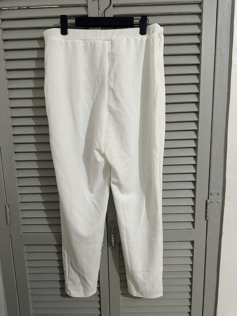 White High-Waisted Pants with Gold Button Detail (Category: Other Bottoms) located in Subic. Submitted by ruffa_assorted_item (Listing ID 1463632985, Image 2). Description: - Stylish white high-waisted pants - Elegant gold double-breasted button detail at the front - Flattering straight leg cut - Comfortable fabric for all-day wear - Perfect for dressing up or down - Measurements available in the photos.