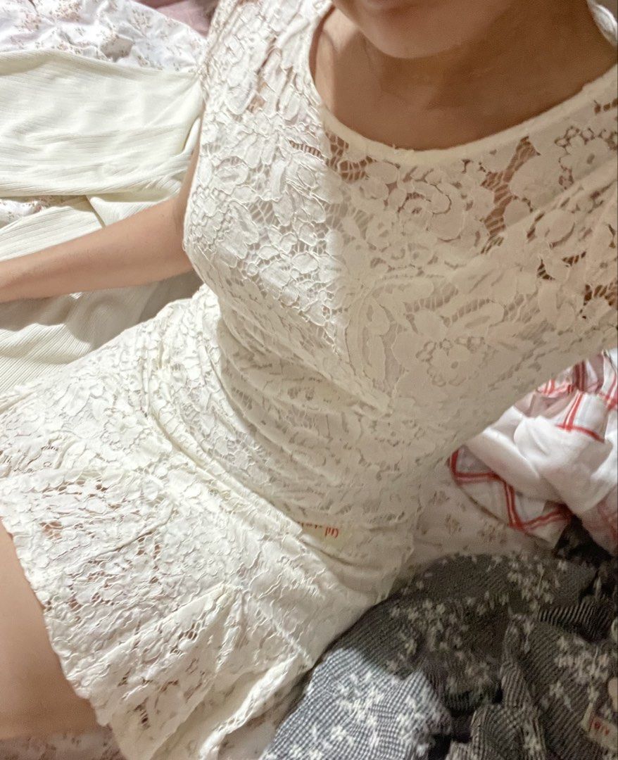 White Lace Short Sleeve Mini Dress (Category: Dresses) located in Rizal. Submitted by pikaapikadclttr (Listing ID 1463585709, Image 2). Description: - White lace mini dress - Short sleeves - Ruffled hem - Estimated Size: Small - Medium - Ideal for parties and events - Comfortable and stylish - Please check photos for condition details.