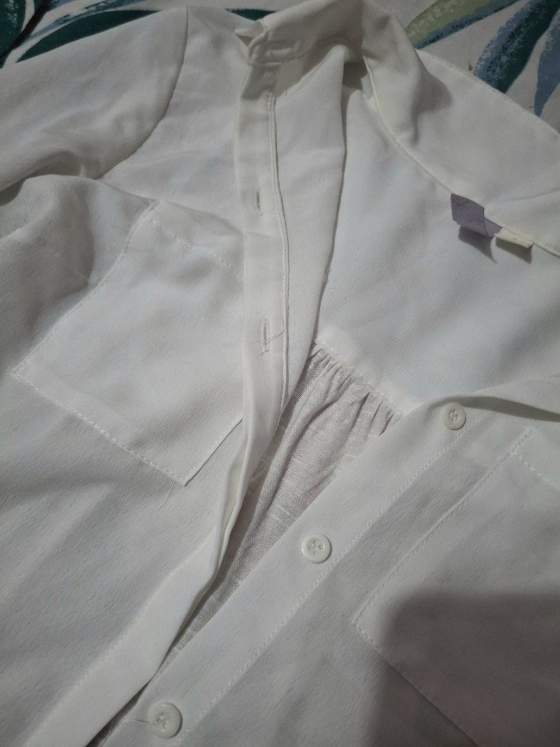 White Long Sleeve Button Up Shirt with Pockets (Category: Longsleeves) located in Manila. Submitted by oddcat_ccd2d5 (Listing ID 1463647380, Image 3). Description: Classic white long sleeve shirt. Hidden button design. See photos for details. Size S-M (S on tag).
