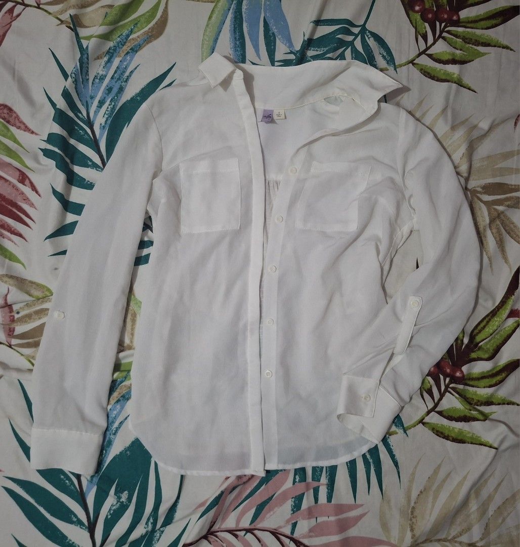 White Long Sleeve Button Up Shirt with Pockets (Category: Longsleeves) located in Manila. Submitted by oddcat_ccd2d5 (Listing ID 1463647380, Image 1). Description: Classic white long sleeve shirt. Hidden button design. See photos for details. Size S-M (S on tag).