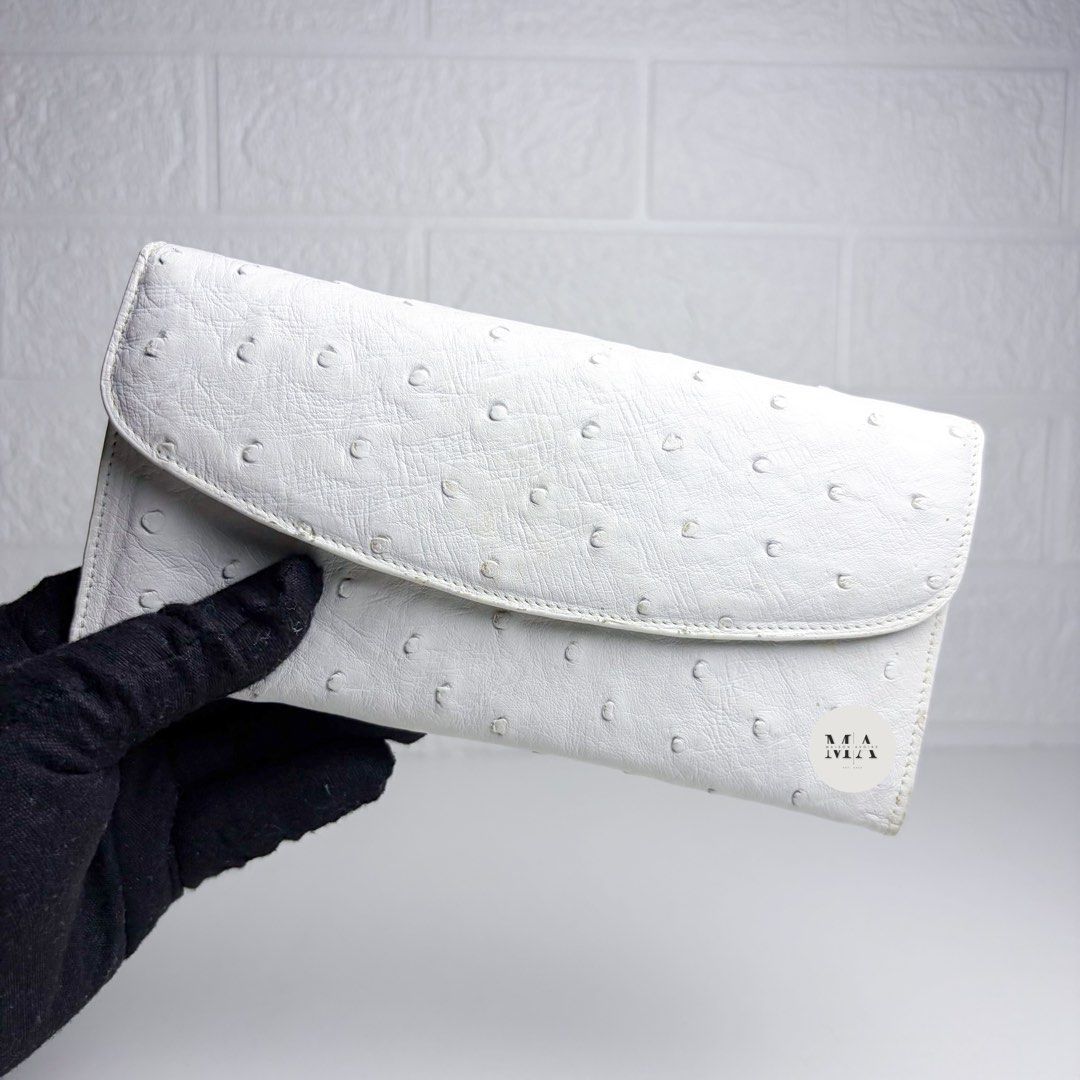 White Ostrich Long Wallet (Category: Luxury Bags & Wallets) located in Manila. Submitted by maisonavoire (Listing ID 1463588985, Image 1). Description: 𝐖𝐡𝐢𝐭𝐞 𝐎𝐬𝐭𝐫𝐢𝐜𝐡 𝐋𝐨𝐧𝐠 𝐖𝐚𝐥𝐥𝐞𝐭 𝐃𝐢𝐬𝐭𝐢𝐧𝐜𝐭𝐢𝐯𝐞 𝐅𝐞𝐚𝐭𝐮𝐫𝐞𝐬: Genuine Ostrich Leather is distinguished by its signature natural quill pattern, formed by raised feather follicles that vary naturally in size and spacing. This creates an unmistakable textured surface unique