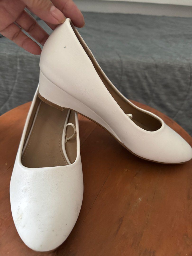White Wedge Heels Size 5 (Category: Wedges) located in Las Pinas. Submitted by megalleon8 (Listing ID 1463684429, Image 3). Description: - Brand: Whimsy - Style: White Wedge Heels - Size: 5 - Type: Slip-on - Sole Color: Brown - Condition: Like new, price tag still attached, minimal signs of wear. - 1x lang ginamit, nakalimutan tanggalin yung tag price 😄 - Need idikit yung front part ng soles.