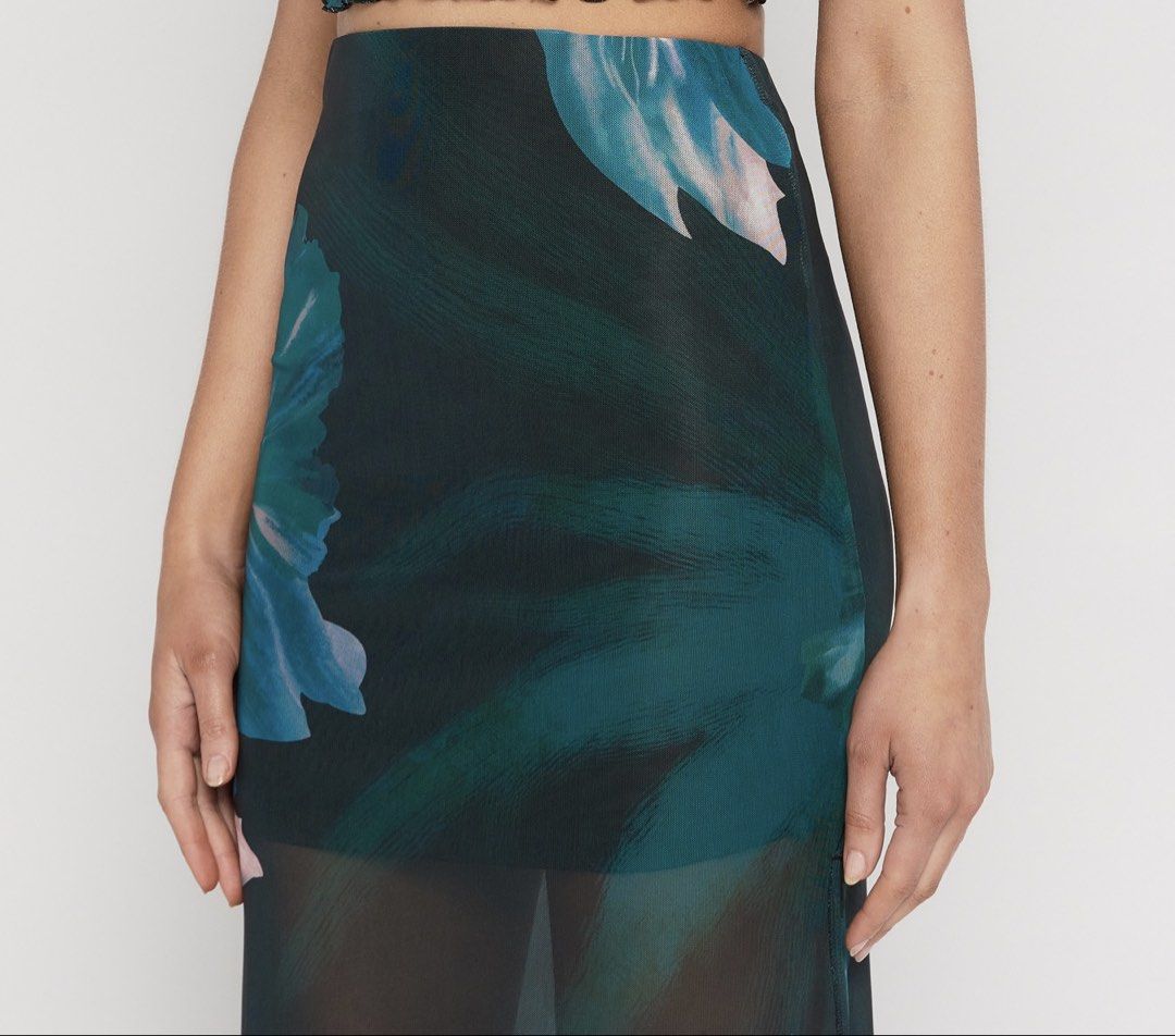 WINNIE & CO. Floral Mesh Midi Skirt (Category: Skirts) located in Batangas. Submitted by wearmegals (Listing ID 1463579193, Image 2). Description: - Floral print mesh fabrication - Sheer, flowy, and lightweight fabric - Elasticated waistband for a comfortable fit - Ideal for layering or beachwear - Pairs well with bikini tops or camisoles - S-M .
