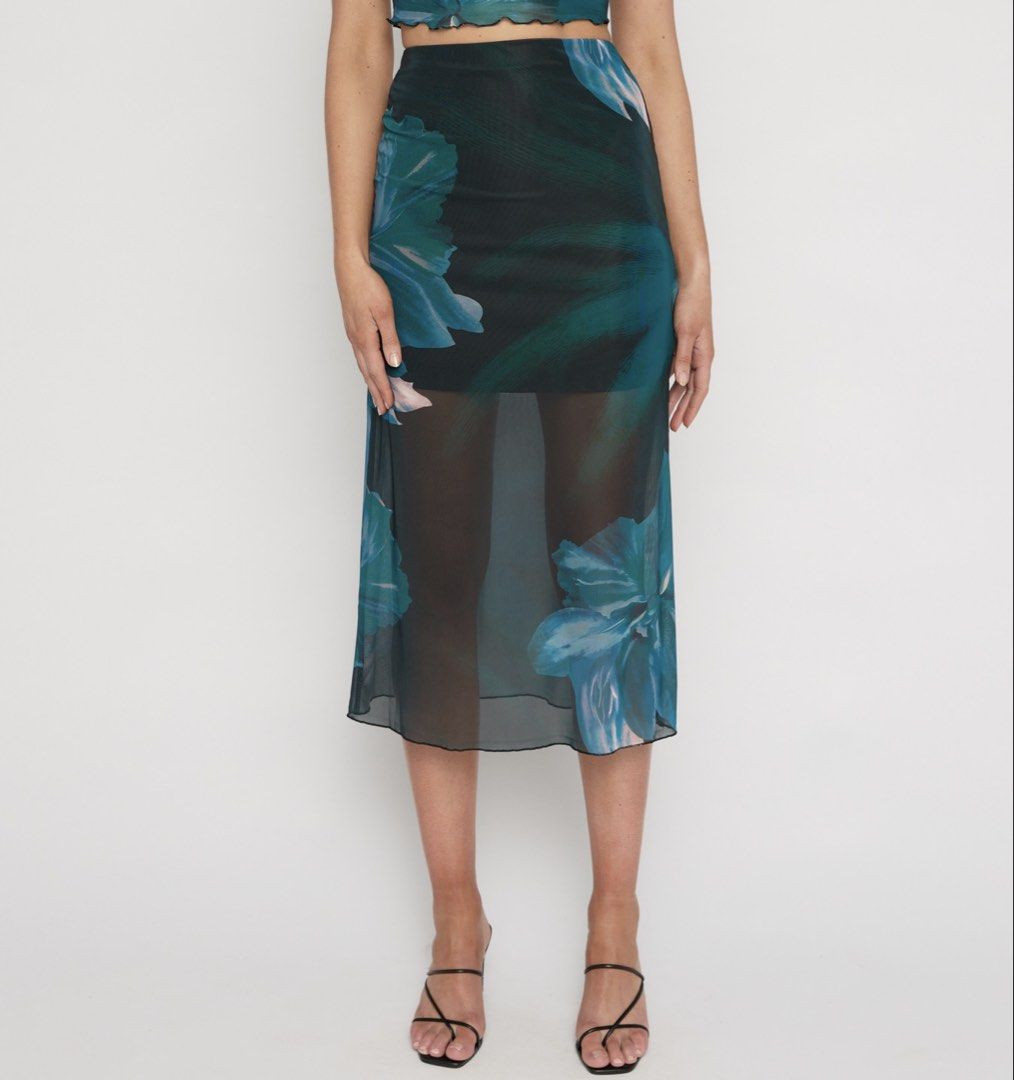 WINNIE & CO. Floral Mesh Midi Skirt (Category: Skirts) located in Batangas. Submitted by wearmegals (Listing ID 1463579193, Image 1). Description: - Floral print mesh fabrication - Sheer, flowy, and lightweight fabric - Elasticated waistband for a comfortable fit - Ideal for layering or beachwear - Pairs well with bikini tops or camisoles - S-M .