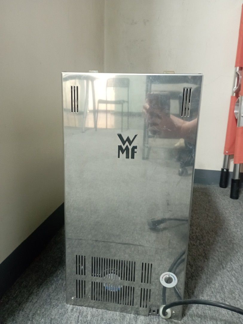 WMF Stainless Steel Kitchen Appliance (Category: Cookware & Accessories) located in Manila. Submitted by _hjmannah (Listing ID 1463670083, Image 1). Description: - Genuine WMF stainless steel appliance - Equipped with side ventilation grilles - Built-in rear fan for efficient operation - Power cord included - Minor scuffs on the surface, adding character - Ideal addition to any kitchen setup.