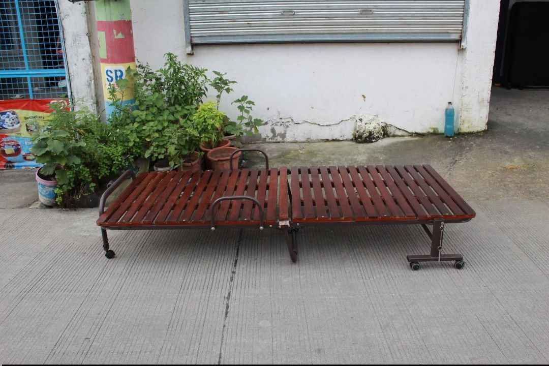 Wooden Folding bed (Category: Other Home Furniture) located in Meycauayan. Submitted by marygracecasimiro (Listing ID 1463629713, Image 1). Description: Folding Wooden Slatted Bed Base with Wheels Breathable sunoko-style platform, sturdy metal frame, integrated mattress guard rails and caster wheels for easy mobility. Folds compactly for convenient storage and is perfect for use with a mattress, futon or cushion pad L:36 • W:79 • H:12 inches 6,00