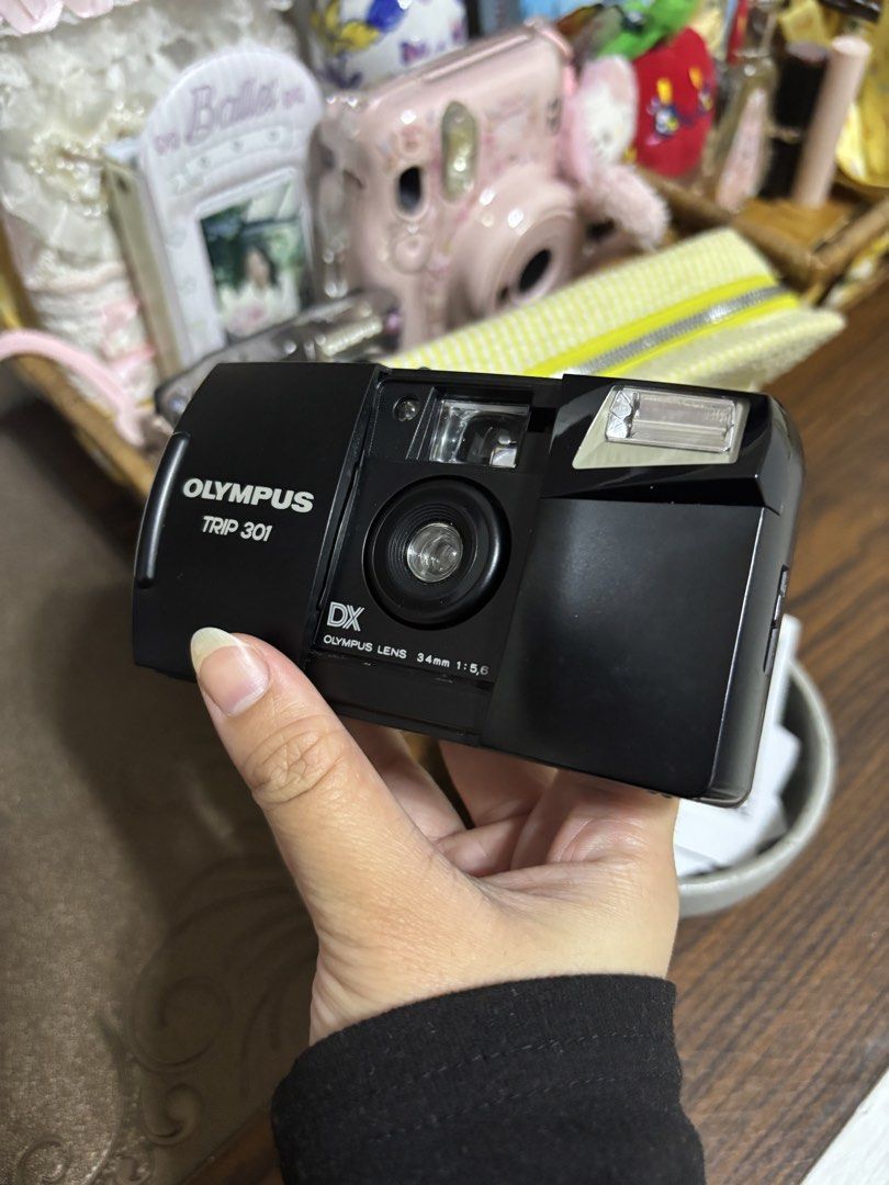 WORKING: Olympus Trip 301 | 35mm Film Camera (Category: Cameras) located in Lubao. Submitted by dear_kalii_cart (Listing ID 1463698483, Image 3). Description: - Olympus Trip 301 point and shoot camera - Uses 35mm film - Built-in flash - Simple operation: load film and shoot - Ideal for beginners and film photography enthusiasts - Includes camera body.