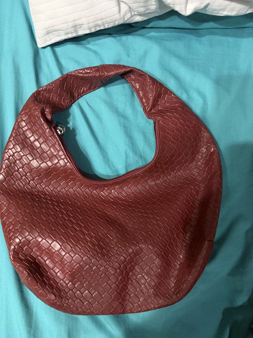 Woven Textured Shoulder Bag - burgundy (Category: Shoulder Bags) located in Quezon City. Submitted by r2wph (Listing ID 1463698738, Image 1). Description: Cool red shoulder bag. It has a woven texture all over. Zipper closure. The shape is a bit slouchy and hobo-like. Great for everyday use. Fits essentials. Handle is comfortable to hold..
