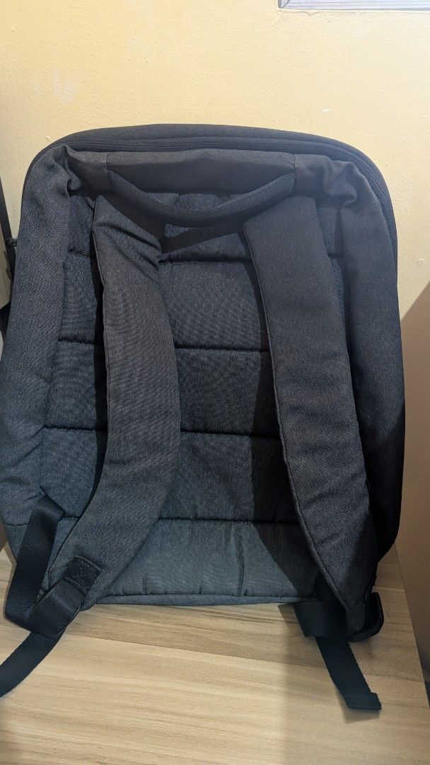 Xiaomi Backpack (Category: Backpacks) located in Paranaque City. Submitted by lai_francisco (Listing ID 1463742086, Image 2). Description: a dark gray Xiaomi Mi City Backpack 2 featuring a minimalist design and a front zippered pocket with "URBAN LIFE STYLE" branding..