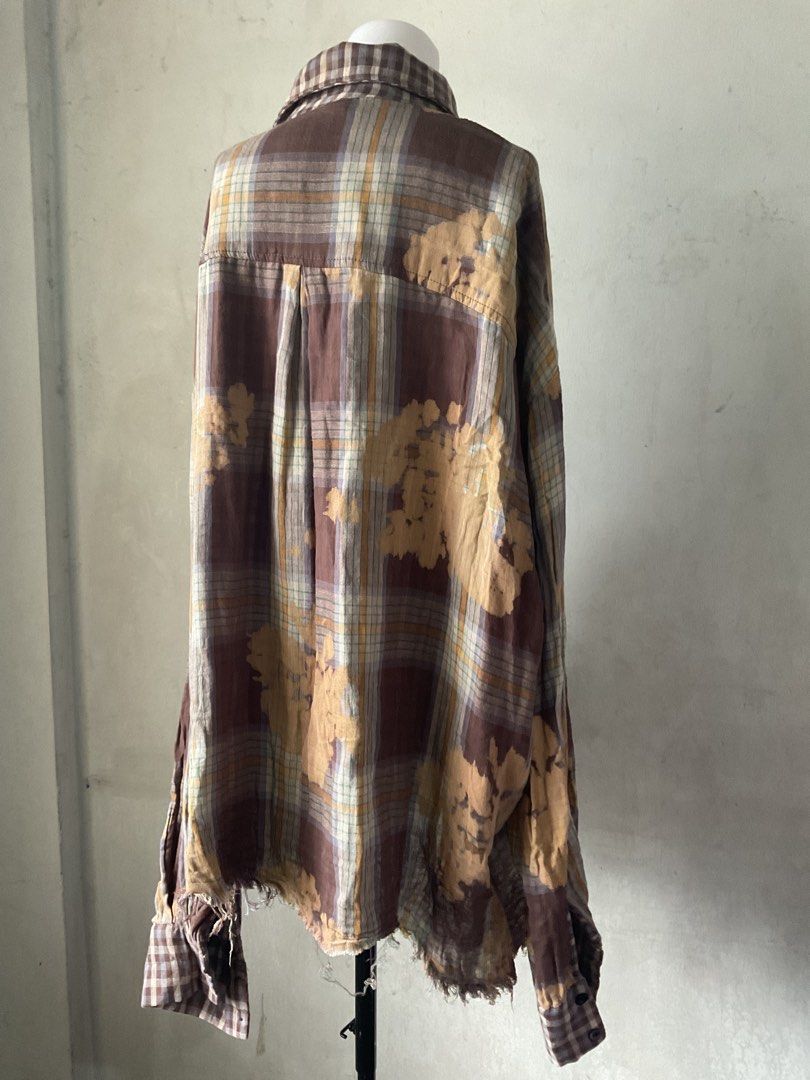 XUQIYANG Plaid Bleached Oversized Shirt (Category: Shirts) located in Manila. Submitted by horangborahae (Listing ID 1463603765, Image 3). Description: - Oversized plaid shirt from XUQIYANG - Unique bleached fabric effect - Distressed hem and cuffs for a vintage look - Button-up front with a chest pocket - Ideal for a casual and edgy style.