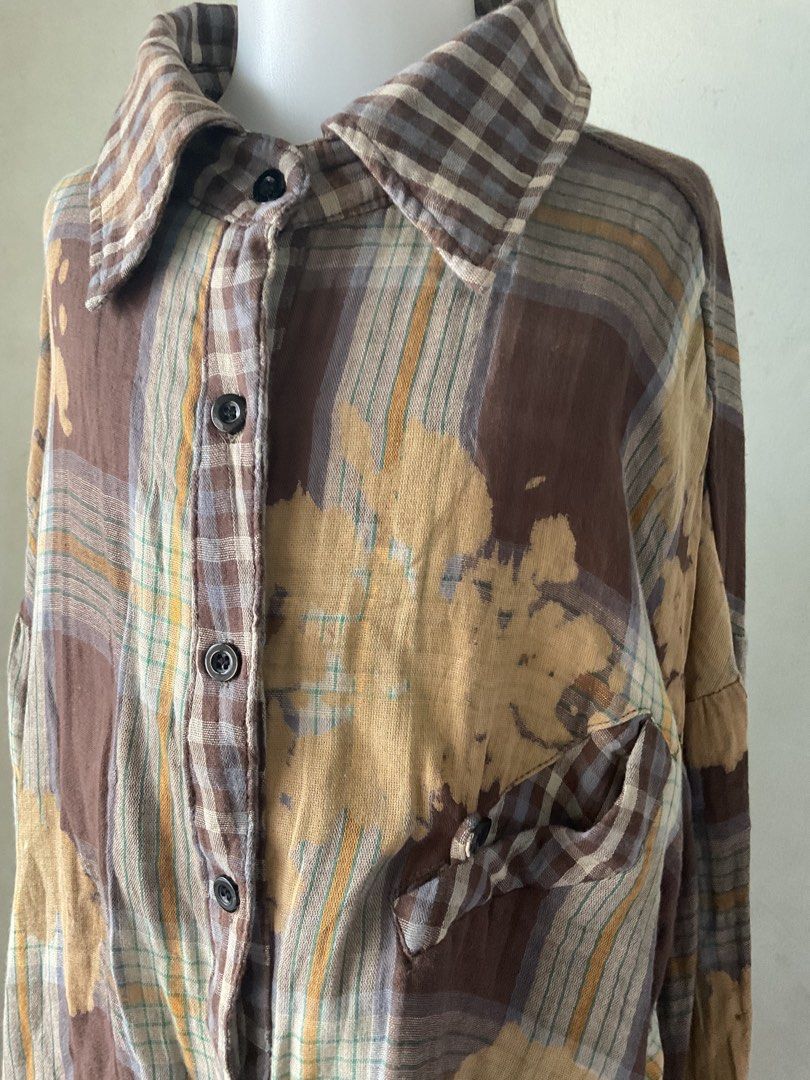 XUQIYANG Plaid Bleached Oversized Shirt (Category: Shirts) located in Manila. Submitted by horangborahae (Listing ID 1463603765, Image 2). Description: - Oversized plaid shirt from XUQIYANG - Unique bleached fabric effect - Distressed hem and cuffs for a vintage look - Button-up front with a chest pocket - Ideal for a casual and edgy style.
