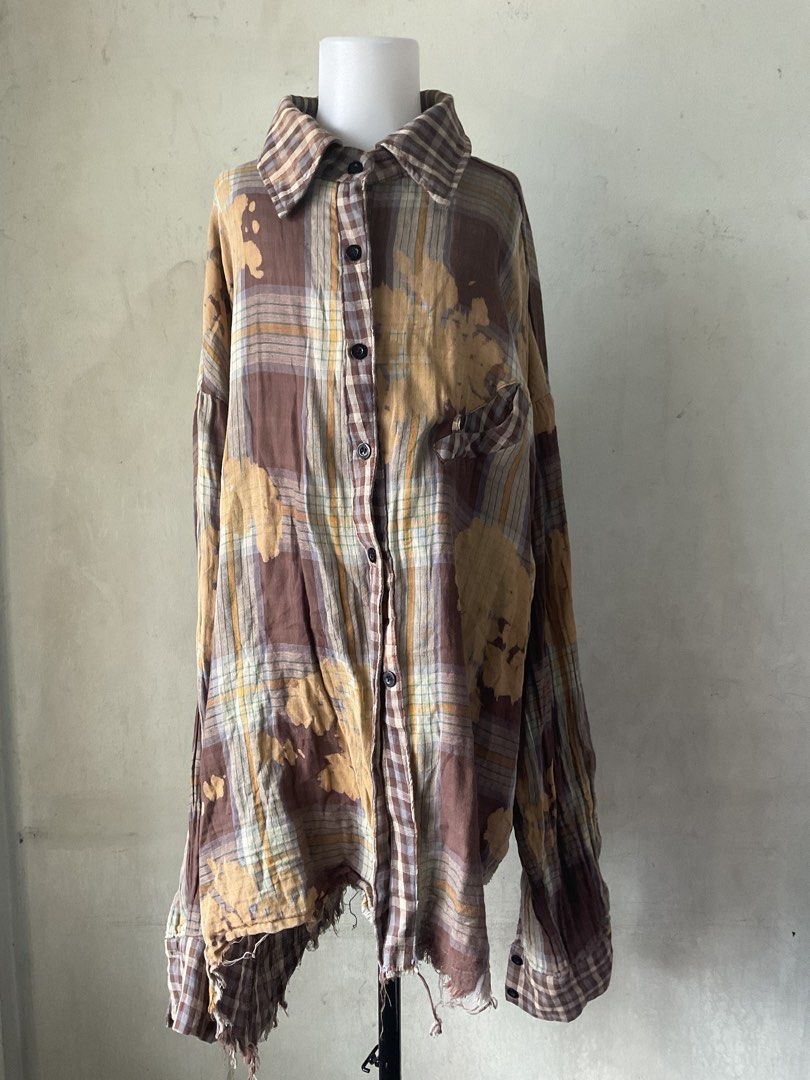 XUQIYANG Plaid Bleached Oversized Shirt (Category: Shirts) located in Manila. Submitted by horangborahae (Listing ID 1463603765, Image 1). Description: - Oversized plaid shirt from XUQIYANG - Unique bleached fabric effect - Distressed hem and cuffs for a vintage look - Button-up front with a chest pocket - Ideal for a casual and edgy style.
